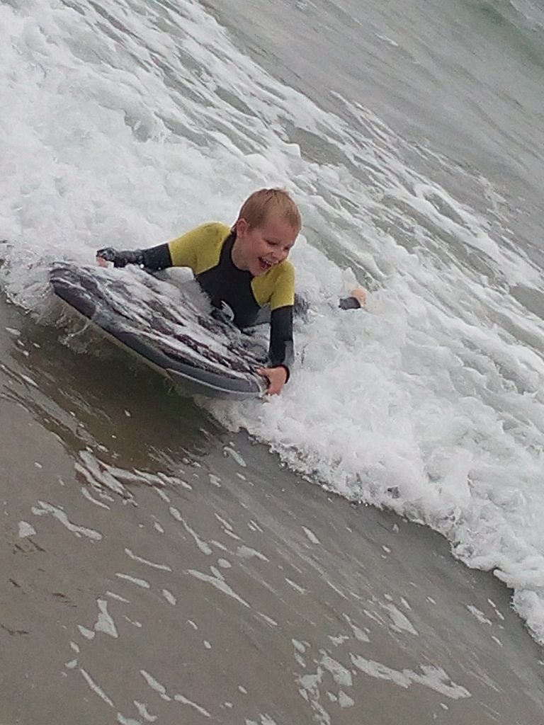 body boarding fun in Cornwall in our kids winter wetsuit. Full 5mm super stretch neoprene with GBS seams
