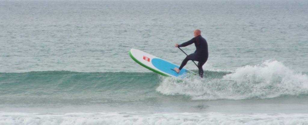 SUP surfing with NCW long John wetsuit