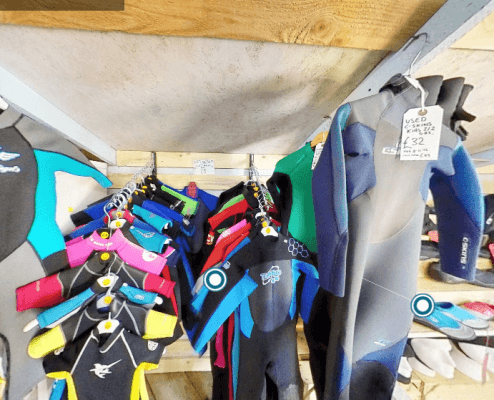 many pre-loved and used wetsuits