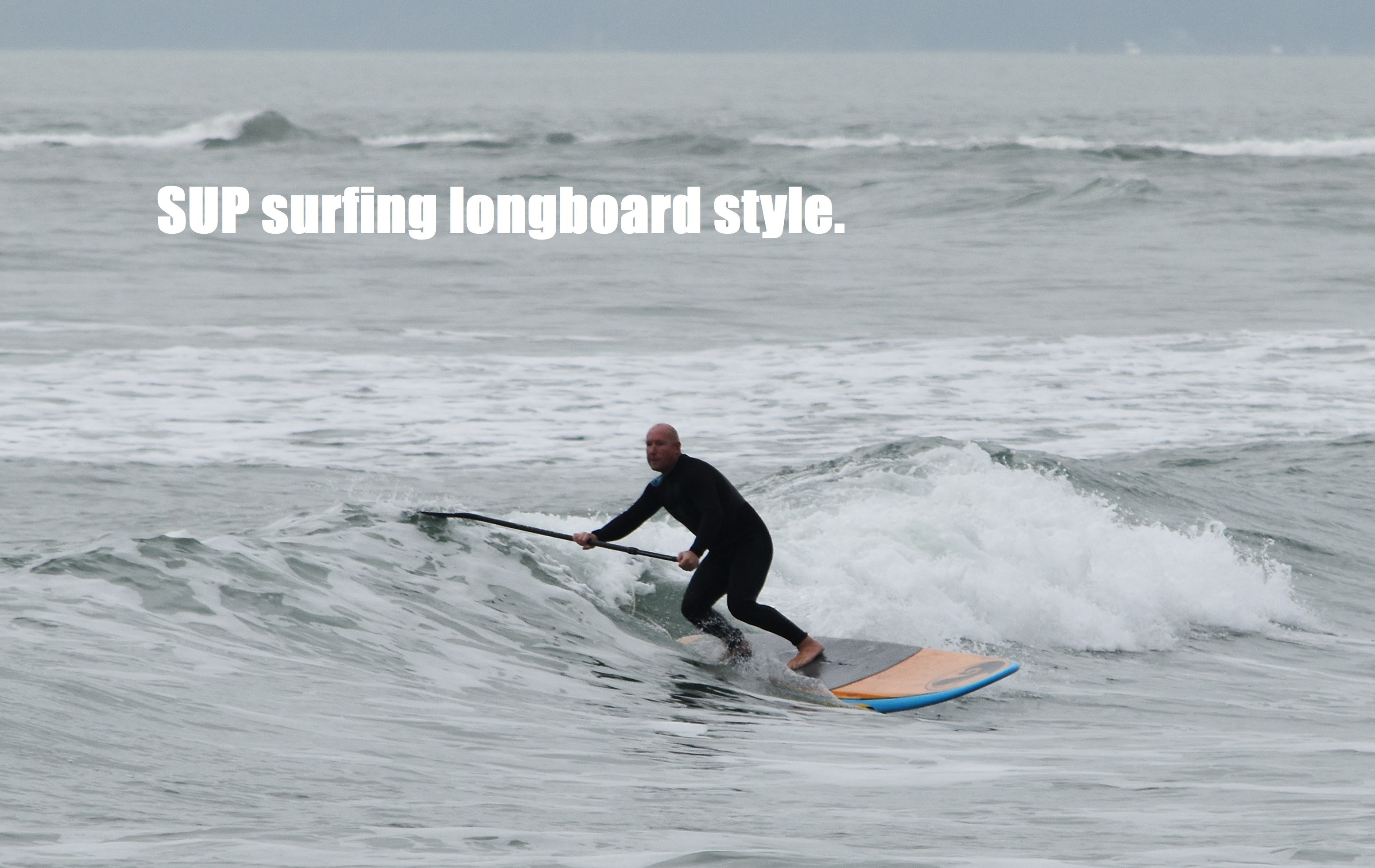 SUP surfing longboard style.